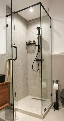 a shower with a glass door in a bathroom at Blue Skies Residence, Luxury Apartment, City Center in Casablanca