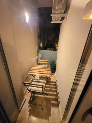 a room with a table and chairs in a room at Luxe & Confort in Cité de Bournazel