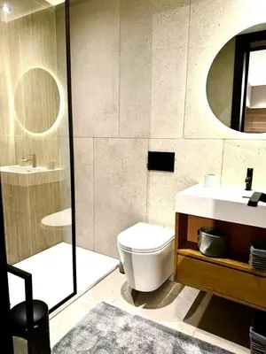a bathroom with a toilet and a sink and a mirror at الدار بيضاء in Casablanca