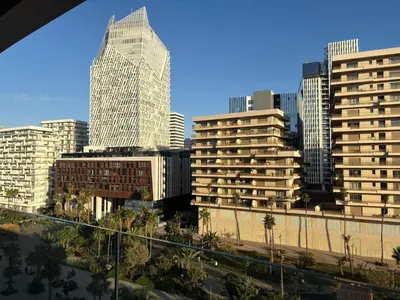 a view of a city with tall buildings at Luxury business 70m apartment -CFC AERIA Mall Casa in Casablanca
