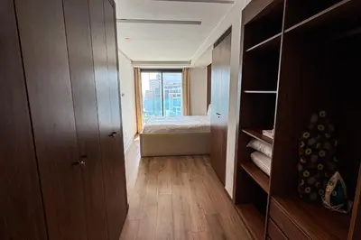 a small room with a bed and a window at Luxury business 70m apartment -CFC AERIA Mall Casa in Casablanca