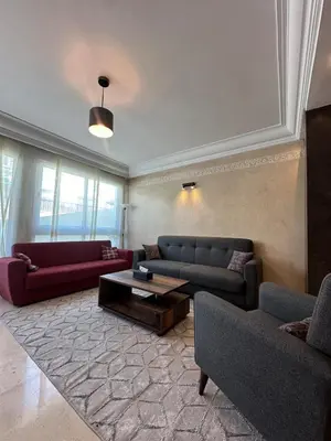 a living room with two couches and a coffee table at Golden Triangle Apartment Rental in Casablanca