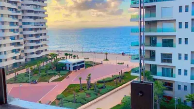 a view of the ocean from a balcony of a building at Marina Apartment Ocean View BY AppartAyla in Casablanca