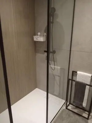a shower in a bathroom with a glass door at المعاريف المارينا in Casablanca