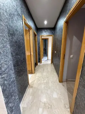 a hallway of a house with a hallway of doors at superbe appart a dar bouaza tamaris avec piscine in Casablanca