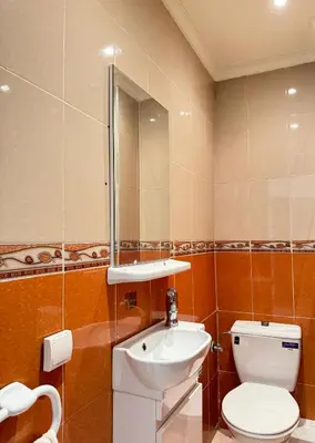 a bathroom with a toilet and a sink at SUITOUISS - AGDAL 5 - Appartements à 2 minutes de la gare de train TGV Rabat in Rabat