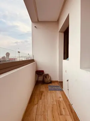 an empty room with a window and a wooden floor at Modern Comfort with Moroccan Soul in Casablanca