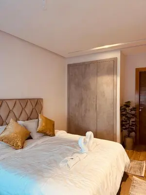 a bedroom with two beds with towels on them at Modern Comfort with Moroccan Soul in Casablanca