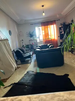 a living room with a couch and two chairs at Private room 2 in Casablanca