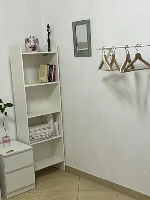 a room with a white shelf with hangers at Private room 2 in Casablanca
