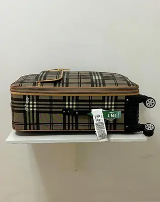 a suitcase sitting on a shelf with a tag on it at Private room 2 in Casablanca