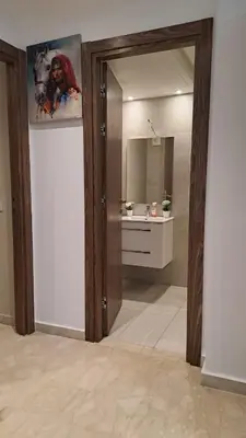 a bathroom with a large mirror and a sink at Studio 27 in Casablanca