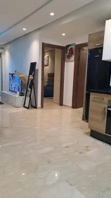 a living room with a flat screen tv and a living room at Studio 27 in Casablanca