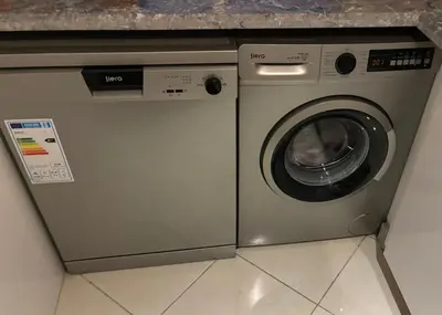 a washing machine sitting next to a dryer at Appartement skhirat in Skhirat