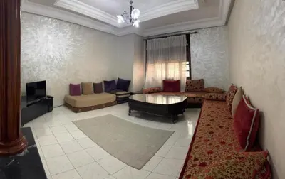 a living room with a couch and a table at Hyatt Residence Casa Voyageur in Casablanca