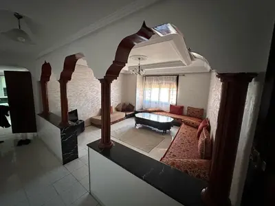 a living room with a couch and a table at Hyatt Residence Casa Voyageur in Casablanca