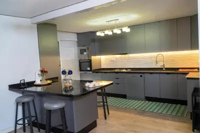 a kitchen with a large island in a room at Stylish apartment - March 2 in Casablanca