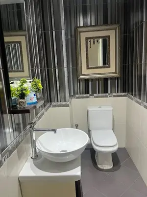 a bathroom with a white toilet and a mirror at Stylish apartment - March 2 in Casablanca