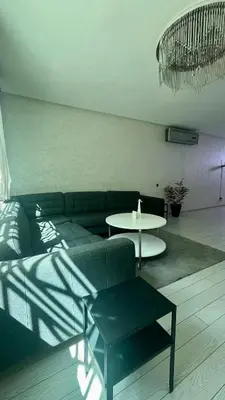 a living room with a couch and a table at Stylish apartment - March 2 in Casablanca