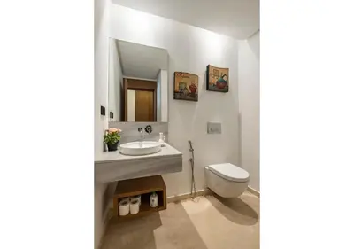 a bathroom with a sink and a toilet at Cosy cocon urbain 34 in Rabat