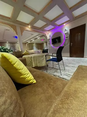 a living room with a couch and a table at Yalla Morocco in Temara