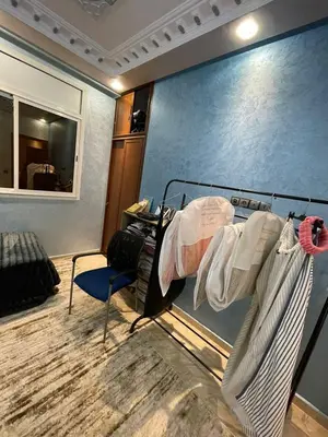 a room with a bunk bed and a chair at Yalla Morocco in Temara