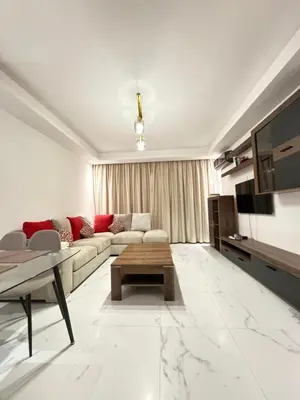 a living room with a couch and a table at ZS house harhoura in El Harhoura
