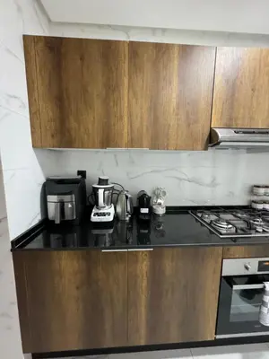 a kitchen with a stove and a counter top at ZS house harhoura in El Harhoura