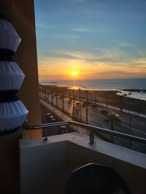 a sunset from a hotel balcony with a view of the ocean at Ailes du vent, coucher de soleil,vue sur mer in Rabat