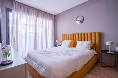 a bedroom with a large bed with a large window at Premium Stay - Lux Housing Bourgogne in Casablanca