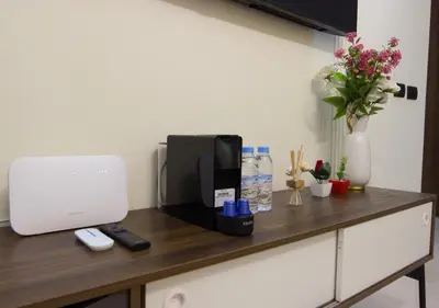 a counter with a coffee maker and flowers on it at R104- Luxurious Penthouse with Incredible Sea View in Casablanca