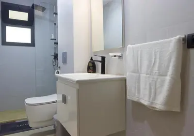 a white bathroom with a sink and a toilet at R104- Luxurious Penthouse with Incredible Sea View in Casablanca