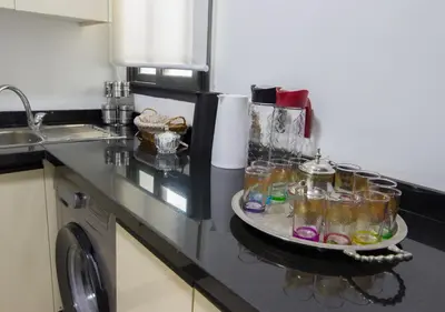 a kitchen counter with a tray with glasses on it at R104- Luxurious Penthouse with Incredible Sea View in Casablanca
