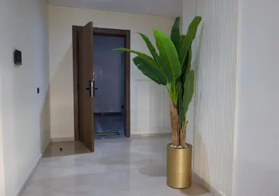 a plant in a gold vase in a hallway at R104- Luxurious Penthouse with Incredible Sea View in Casablanca