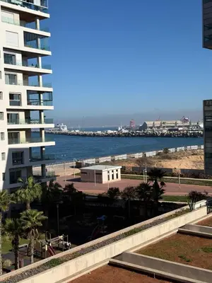 a view of the beach and the ocean from a building at Stunning sea-view apartment 20 in Casablanca