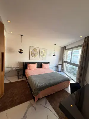 a bedroom with a large bed and a window at Stunning sea-view apartment 20 in Casablanca
