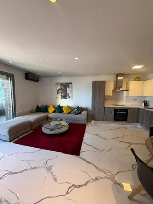 a living room with a couch and a table at Stunning sea-view apartment 20 in Casablanca