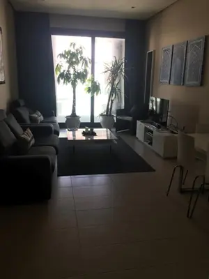 a living room with a couch and a window at Unique in Casablanca