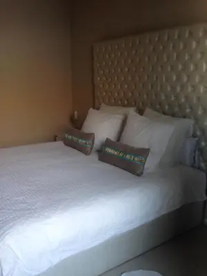 a large white bed with two pillows on it at Unique in Casablanca