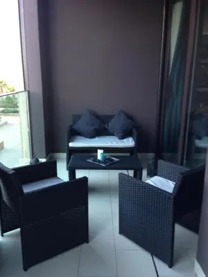 a living room with a couch and chairs and a table at Unique in Casablanca