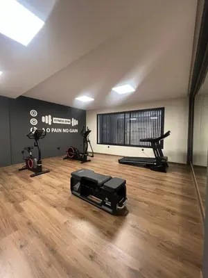 a gym with treadmills and exercise equipment in a room at studio tout confort, près de la corniche Casablanca in Casablanca