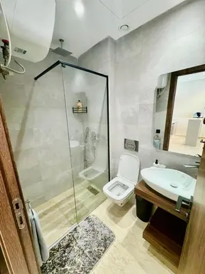 a bathroom with a shower and a toilet and a sink at studio tout confort, près de la corniche Casablanca in Casablanca