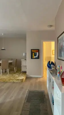 a living room with a kitchen and a dining room at Spacious Apartment In CIL Casablanca in Casablanca