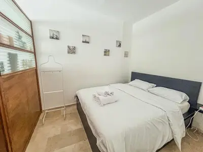 a bedroom with a bed with two towels on it at Central and Practical Studio - Boulevard d'Anfa in Casablanca