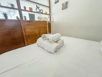 a bedroom with two towels sitting on a bed at Central and Practical Studio - Boulevard d'Anfa in Casablanca