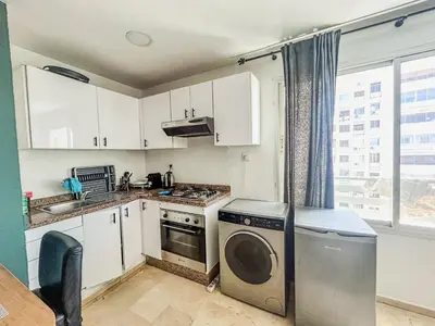 a kitchen with a washer and a dishwasher at Central and Practical Studio - Boulevard d'Anfa in Casablanca
