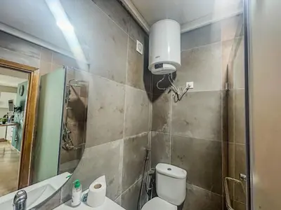 a bathroom with a toilet and a sink and a mirror at Central and Practical Studio - Boulevard d'Anfa in Casablanca