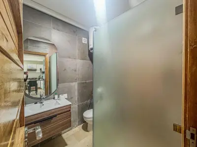 a bathroom with a toilet and a sink at Central and Practical Studio - Boulevard d'Anfa in Casablanca