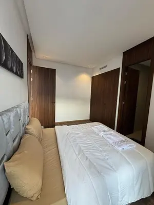 a bedroom with a large white bed in it at Appartement Casablanca in Casablanca