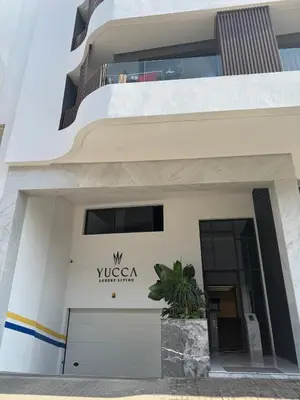 a building with a sign that reads vyssaya residence at Appartement Casablanca in Casablanca